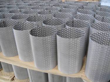 Many filter tubes with a layer of fine woven wire mesh outside and perforated <d><d>meta</d></d>l inside.