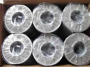 Many ring type filter discs in a carton.